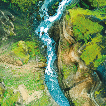 Aerial Shot Of River Running Through Valley