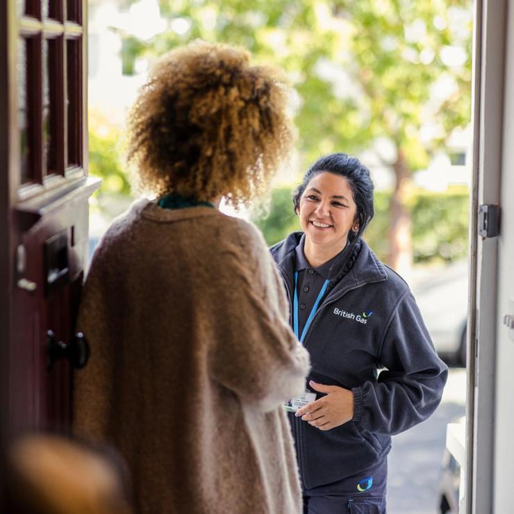 Female Engineer At Door Of A Customer